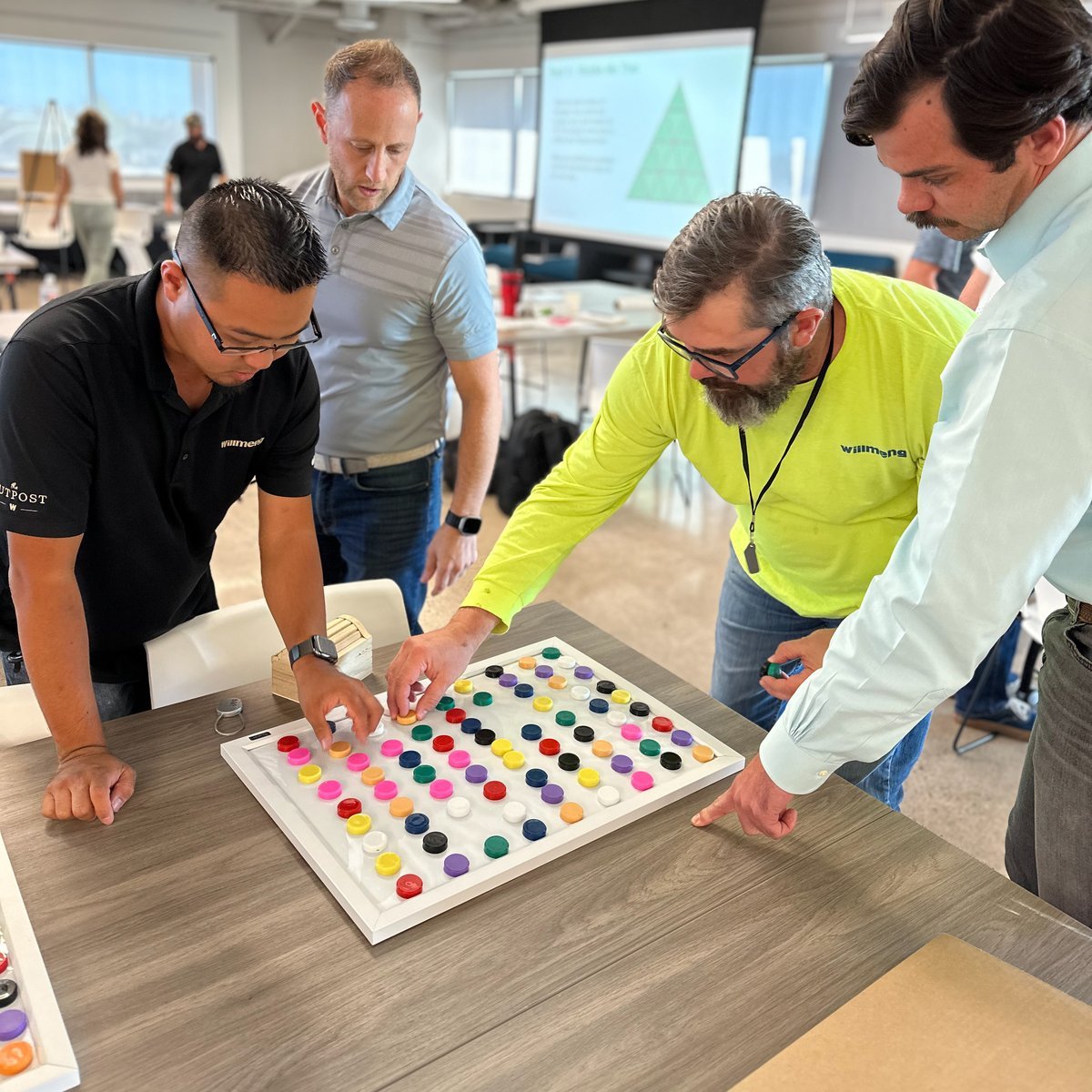 Leaders working through a hands-on team exercise during a Leader Lab session